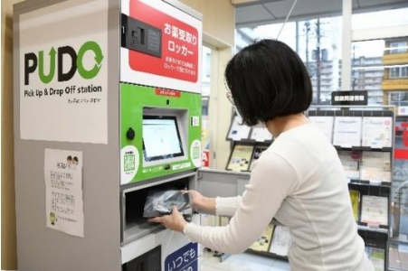 a woman collecting a parcel from PUDO station